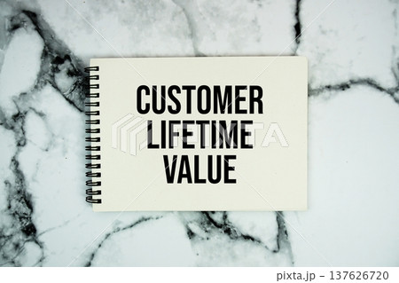 Customer Lifetime Value text written on notepad flat lay on marble background Customer Lifetime Value text written on notepad flat lay on marble background 137626720