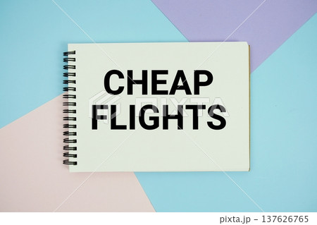 Cheap Flights text written on notepad flat lay on multicolor pastel background Cheap Flights text written on notepad flat lay on multicolor pastel background 137626765