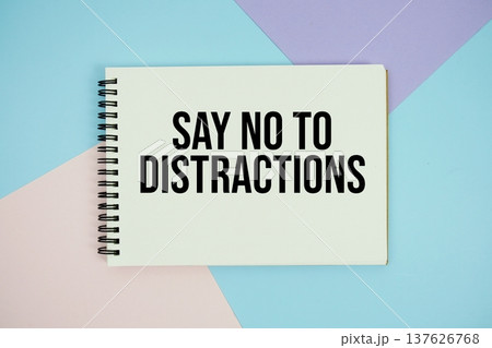 Say No To Distractions text written on notepad flat lay on multicolor pastel background Say No To Distractions text written on notepad flat lay on multicolor pastel background 137626768