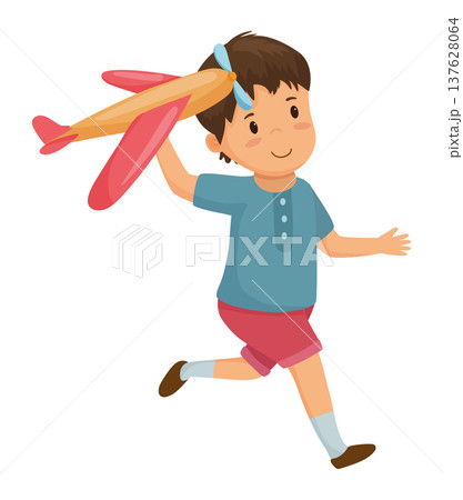 Boy Playing with a Toy Airplane 137628064