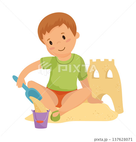 Boy Playing in a Sand Castle Boy Playing in a Sand Castle 137628071
