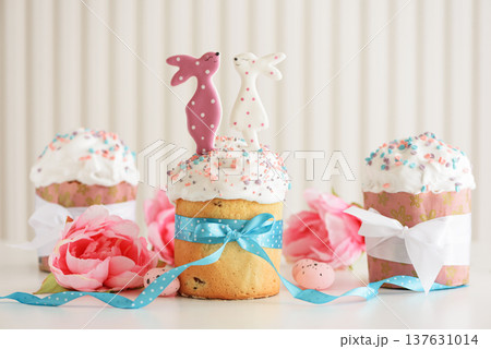 Easter cakes with Bunny Toppers and Flowers. Festive Spring Composition 137631014