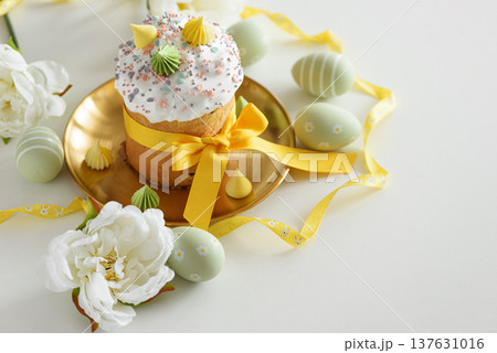 Easter Cake with Flowers and Pastel Eggs on White Background 137631016