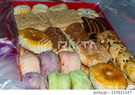 Assorted pastries and buns in a red gift box 137631347