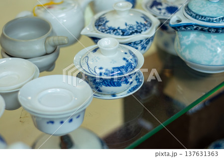 Blue and white porcelain tea set on glass table 137631363