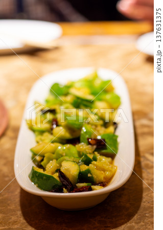 Spicy cucumber salad appetizer in white dish 137631375