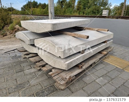 Concrete structures, blocks for supporting metal railings near a railway 137631579
