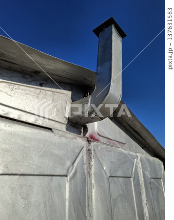 Exhaust or ventilation pipes in garage for a car Exhaust or ventilation pipes in garage for a car 137631583