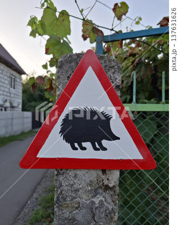 Drivers are warned with signs of hedgehogs in rural areas Drivers are warned with signs of hedgehogs in rural areas 137631626