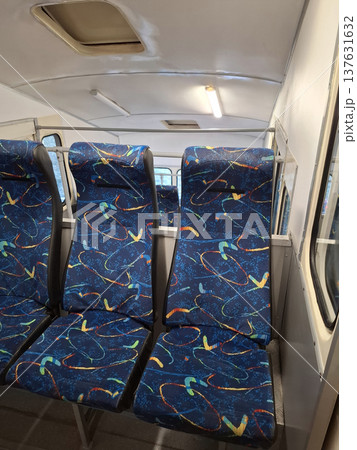 Blue seats are free in the empty funicular cabin Blue seats are free in the empty funicular cabin 137631632