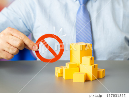 Boxes of goods and a prohibition sign. Embargoed goods blocked from international trade. Tariff wars, sanctions and restrictions disrupting global supply chains and market access. Boxes of goods and a prohibition sign. Embargoed goods blocked from international trade. Tariff wars, sanctions and restrictions disrupting global supply chains and market access. 137631835