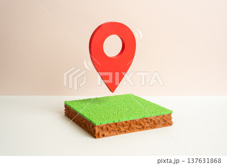 Land plot and geolocation marker. Investments in land holdings and cadastral registration. Mapping precise boundaries of property and tracking real estate assets in digital systems. 137631868