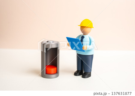 An engineer studies the problem of low battery power. Challenges of energy autonomy and system safety. Technical diagnostics, energy storage efficiency and reliability of power supply systems. An engineer studies the problem of low battery power. Challenges of energy autonomy and system safety. Technical diagnostics, energy storage efficiency and reliability of power supply systems. 137631877