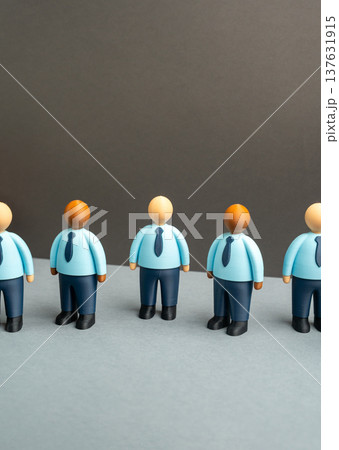 A line of office workers standing together. Corporate ethics, office culture and teamwork in a company. Hiring employees, training newcomers and building professional workplace relationships. A line of office workers standing together. Corporate ethics, office culture and teamwork in a company. Hiring employees, training newcomers and building professional workplace relationships. 137631915