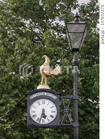 This historic Tottenham Hotspur Clock is a cherished club relic. Perched atop is a replica of the iconic Golden Cockerel, representing fighting spirit, It stands proudly outside the Tottenham Hotspur 137632278