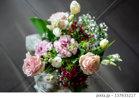 Elegant floral bouquet presenting various pale pink, white, and red flowers with green foliage, creating a romantic and festive arrangement for celebration or a special occasion Elegant floral bouquet presenting various pale pink, white, and red flowers with green foliage, creating a romantic and festive arrangement for celebration or a special occasion 137633217