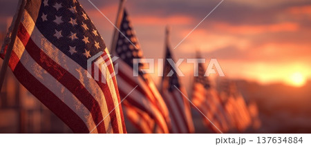 A Majestic Display of American Flags Bathed in Golden Sunset Light, Symbolizing Freedom and Patriotism 137634884