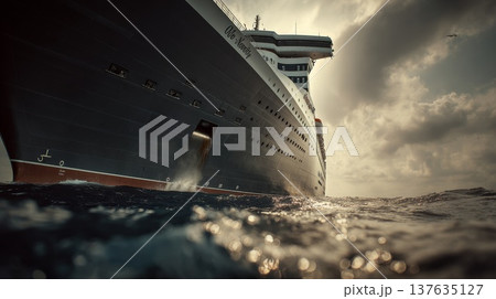 Majestic cruise ship sailing on the open ocean under a clear blue sky with sunlit waves. Majestic cruise ship sailing on the open ocean under a clear blue sky with sunlit waves. 137635127
