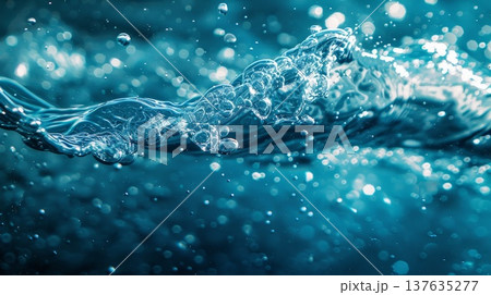 Majestic ocean wave breaks gracefully, creating a stunning display of bubbles under the golden sunlight. 137635277