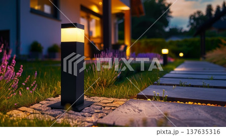 Enchanting evening glow of a garden lamp illuminating the serene outdoor setting under a starry night sky. Enchanting evening glow of a garden lamp illuminating the serene outdoor setting under a starry night sky. 137635316
