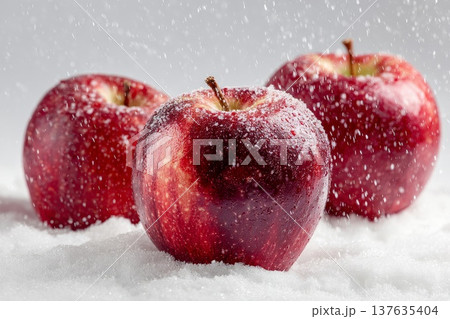 Beautiful red apples on white snow Beautiful red apples on white snow 137635404