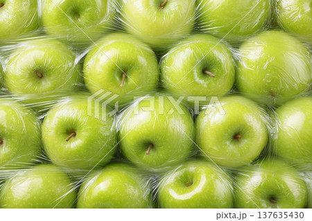 Fresh green apples packed under film, close-up 137635430