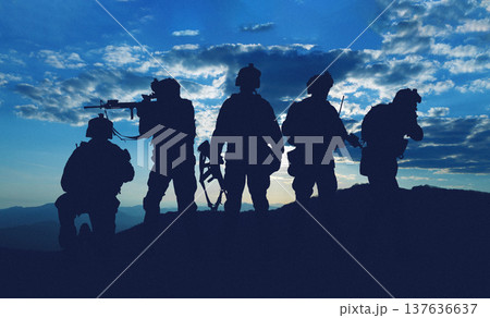 Military personnel stand silhouetted against the sky during a conflict involving Iran and USA 137636637