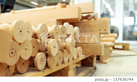 Wooden pieces stored in a workshop near tools and machinery for future projects Wooden pieces stored in a workshop near tools and machinery for future projects 137636744