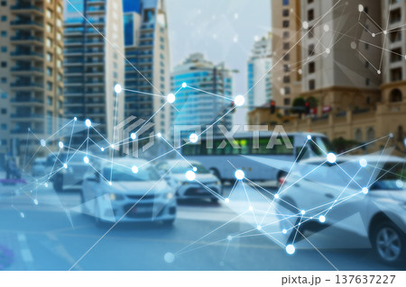 Traffic moves through a city with buildings in the background and data lines overlay Traffic moves through a city with buildings in the background and data lines overlay 137637227
