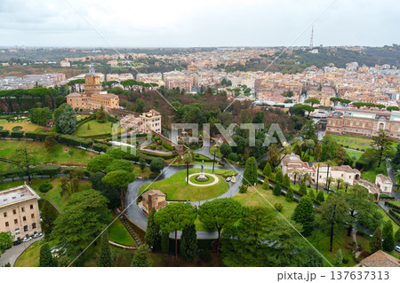 View of green gardens and historic buildings in Rome on a cloudy day View of green gardens and historic buildings in Rome on a cloudy day 137637313