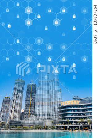 City skyline shows modern buildings with digital data protection symbols above the structures 137637364