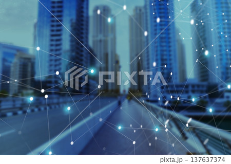 City skyline shows modern buildings with digital network elements at sunset 137637374
