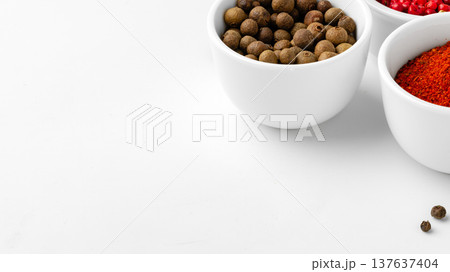 Different spices in white bowls on a plain surface during daytime Different spices in white bowls on a plain surface during daytime 137637404