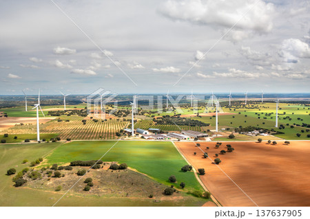 Aerial drone view of wind turbines across Aerial drone view of wind turbines across 137637905