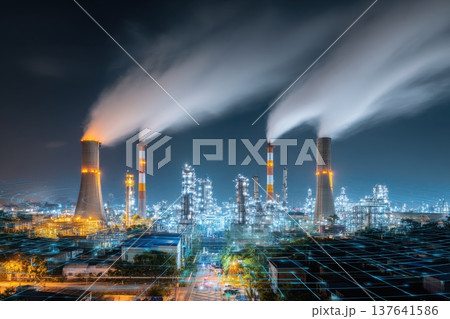 Nighttime Panorama of a Petrochemical Refinery with Emissions and Bright Lights 137641586