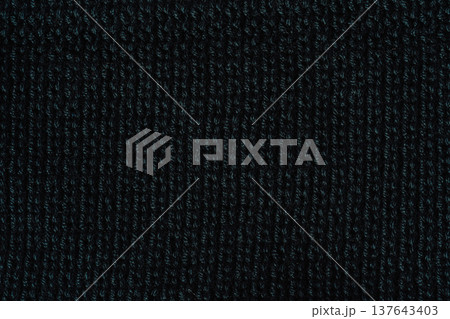 Dark knitted fabric texture background, close up textile surface Dark knitted fabric texture background, close up textile surface 137643403