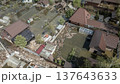 Spring flood disaster with fully submerged houses, flooded roads and overflowing waterways. The footage shows the dramatic impact of heavy rainfall and rising water levels on residential areas 137643633