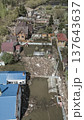 Spring flood disaster with fully submerged houses, flooded roads and overflowing waterways. The footage shows the dramatic impact of heavy rainfall and rising water levels on residential areas 137643637