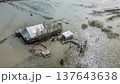 Spring flood disaster with fully submerged houses, flooded roads and overflowing waterways. The footage shows the dramatic impact of heavy rainfall and rising water levels on residential areas 137643638