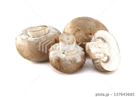 A group of fresh, whole and sliced cremini mushrooms on a clean white background A group of fresh, whole and sliced cremini mushrooms on a clean white background 137643685