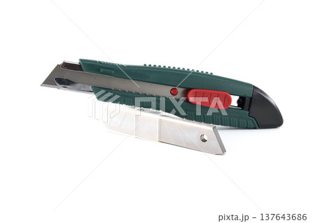 Utility knife with spare blades and safety cutter, ready for precise cutting tasks 137643686