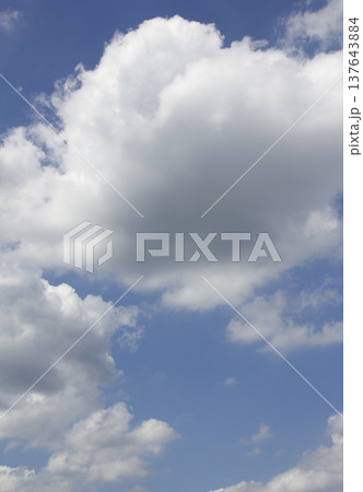 Blue sky with puffy clouds 137643884