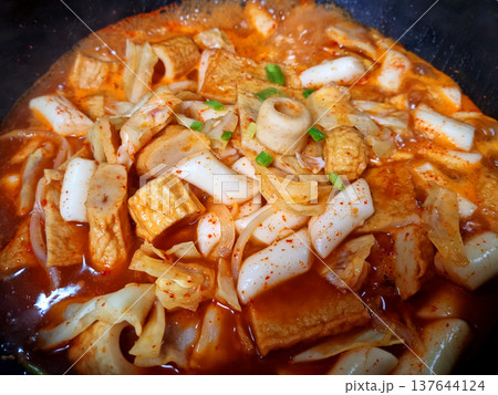This is Korean style tteokbokki being boiled in a pot.	 137644124