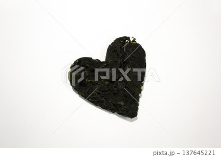 Heart-shaped Undaria pinnatifida placed on a white background. Heart-shaped Undaria pinnatifida placed on a white background. 137645221