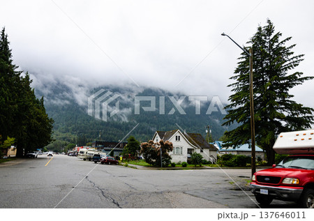 Hope town in BC, Canada with cloud covered mountains in the background Hope town in BC, Canada with cloud covered mountains in the background 137646011
