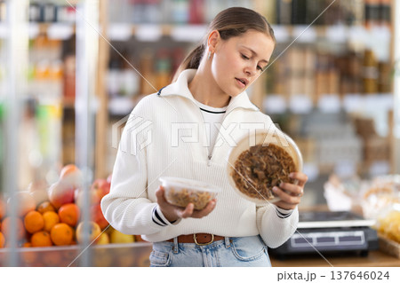 European woman chooses cooked noodles European woman chooses cooked noodles 137646024
