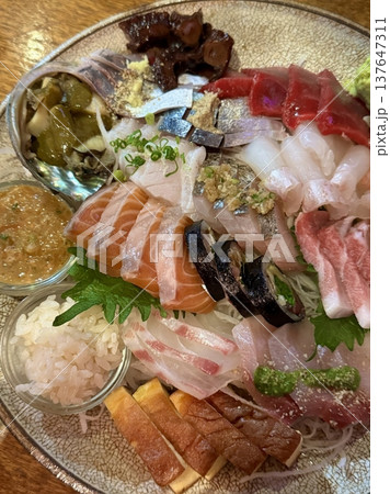 Fresh and delicate sashimi slices, beautifully presented with vibrant colors and perfect cuts. This traditional Japanese delicacy highlights the pure flavors of premium seafood. Fresh and delicate sashimi slices, beautifully presented with vibrant colors and perfect cuts. This traditional Japanese delicacy highlights the pure flavors of premium seafood. 137647311