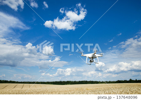 The drone copter flying with digital camera. 137648096