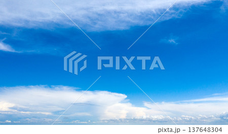 blue sky background with tiny clouds blue sky background with tiny clouds 137648304
