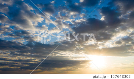 Sunset with sun rays, sky with clouds and sun. 137648305